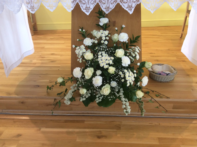 Linda's stunning floral display in front of the altar.